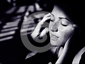 Face portrait with deep emotions and smile, black and white monochrome, art genre portrait with light and shadows in old film