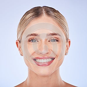 Face portrait, smile and skincare of woman in studio isolated on a blue background. Makeup cosmetics, closeup and beauty