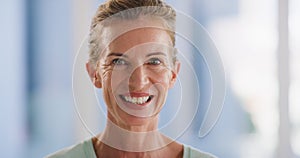 Face portrait of smiling mature woman showing white teeth after dental whitening treatment. Closeup headshot of friendly