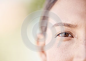 Face portrait of a woman eye thinking with mockup or blurred background with bokeh. Head of a serious or focus young