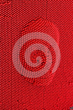 Face pressed to red pin art board