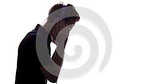 Face profile silhouette of music lover teenager listening to favorite song in headphones , handsome young man on white 