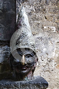 Face of Pulcinella in a Naples road of spaccanapoli photo