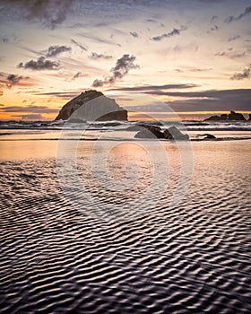 Face Rock Bandon Oregon with closeup of ripples in sand on beach