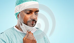 Face of sad doctor or surgeon with protective mask