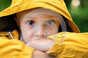 The face of a sad, little boy, with big beautiful eyes.