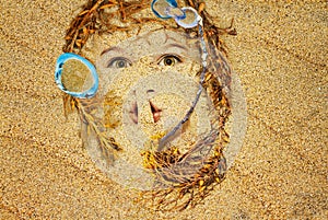 Face in the sand