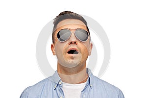 Face of scared man in shirt and sunglasses