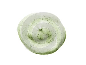 Face scrub cream texture. Green cosmetic exfoliation cleanser round blob isolated on white photo