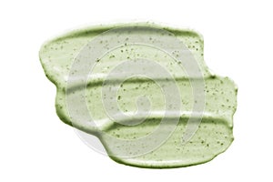 Face scrub creamy texture. Green natural cosmetic exfoliation cleanser smear smudge isolated on white. Facial mask sample photo