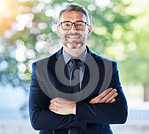 Face, senior ceo and man with arms crossed outdoor for business, entrepreneurship and professional with smile. Portrait