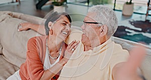Face, senior couple and selfie on sofa to laugh, talk or playful for bonding together in retirement. Old man, woman and