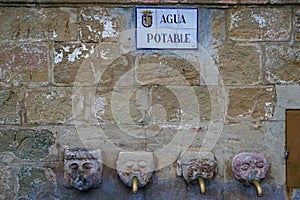 Face shaped drinking fountains in Grazalema, Spain