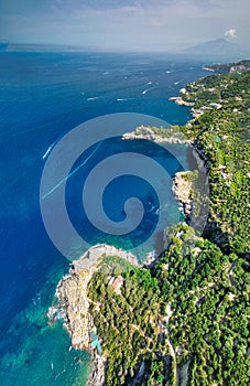 Face shapes coast along Punta Campanella near Sorrento, Italy. Amazing aerial view from drone in summer season photo