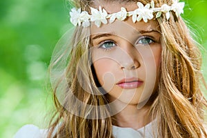 Face shot of cute girl with headband.