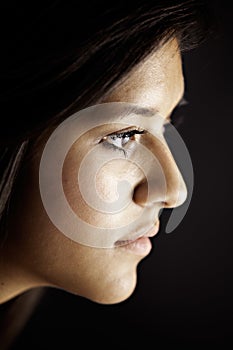 Face Side View of Teenage Female Girl on Black