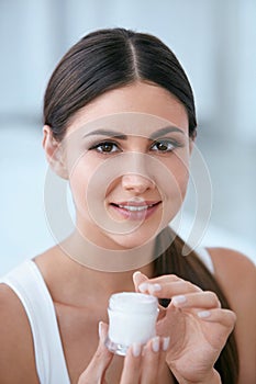 Face Skin Care. Beautiful Woman With Facial Cream. Cosmetics