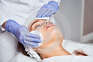 Face Skin Care. Close-up Of Woman Getting Facial Hydro Microdermabrasion Peeling Treatment At Cosmetic Beauty Spa Clinic