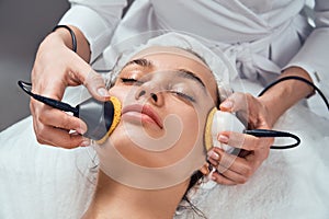 Face Skin Care. Close-up Of Woman Getting Facial Hydro Microdermabrasion Peeling Treatment At Cosmetic Beauty Spa Clinic