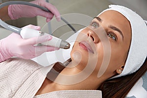 Face Skin Care. Close-up Of Woman Getting Facial Hydro Microdermabrasion Peeling Treatment At Cosmetic Beauty Spa Clinic