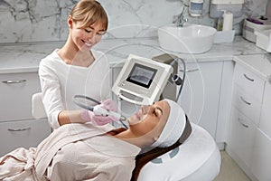 Face Skin Care. Close-up Of Woman Getting Facial Hydro Microdermabrasion Peeling Treatment At Cosmetic Beauty Spa Clinic