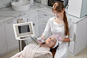 Face Skin Care. Close-up Of Woman Getting Facial Hydro Microdermabrasion Peeling Treatment At Cosmetic Beauty Spa Clinic