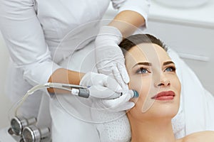 Face Skin Care. Closeup Of Woman Face Cleansing At Cosmetology