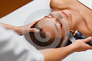 Face skin care treatment. Ultrasound cavitation procedures. photo