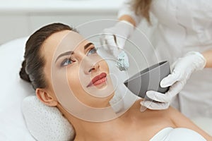 Face Skin Care. Woman Doing Alginate Facial Mask At Cosmetology