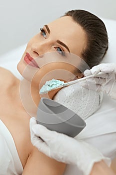 Face Skin Care. Woman Doing Alginate Facial Mask At Cosmetology