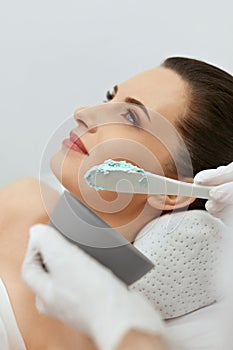 Face Skin Care. Woman Doing Alginate Facial Mask At Cosmetology