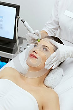 Face Skin Care. Woman Getting Facial Hydro Exfoliating Treatment