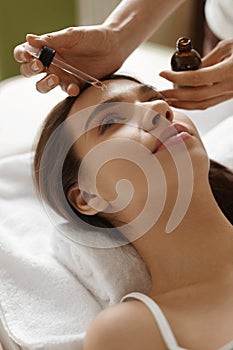 Face Skin Care. Woman Receiving Serum Treatment In Beauty Salon