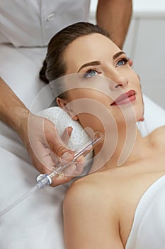 Face Skin Cleaning At Beauty Clinic. Woman Gets Vacuum Treatment