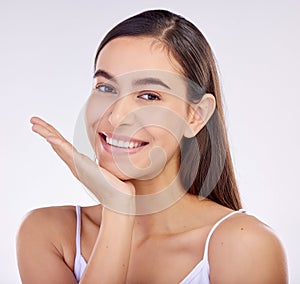 Face, skincare hand and beauty of woman with smile isolated on a white background in studio. Portrait, happy and natural