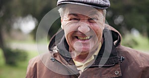 Face, smile and funny with a senior man laughing outdoor in a park closeup for freedom, comedy or humor. Portrait, happy