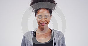 Face, smile and funny with a woman in studio on a white background for comic or laughter in casual clothes. Portrait