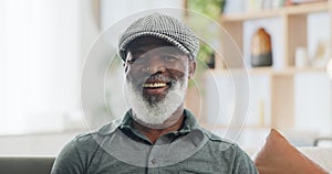 Face, smile and hat with senior black man on sofa in living room of retirement home to relax. Portrait, funny and
