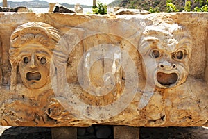 Face on the stone bas-reliefs in the ancient city Myra