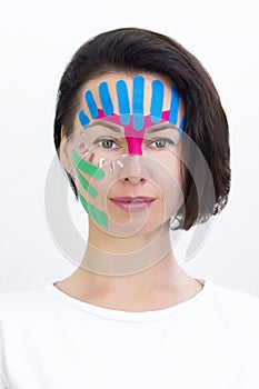 Face taping, close-up of a girls face with cosmetologi