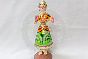 Face of a Thanjavur dancing doll Called as Thalaiyatti Bommai in Tamil language with look alike traditional dress and oranments