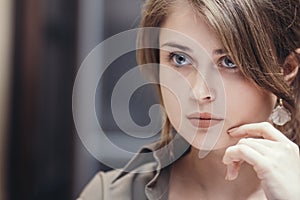 Face of a tired woman after work, propping her head on her hand, concept price of success, business difficulties, modern lady`s