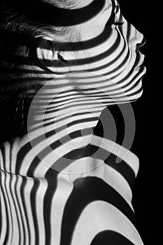 The face of woman with black and white zebra