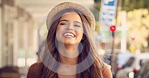 Face, woman and blowing air kiss in city for travel vacation with happiness and smile as tourist. Portrait, female