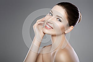 Face of woman with blue eyes and clean fresh skin. Beautiful smile and white teeth