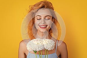 face of woman with womens day flowers isolated on yellow. woman with womens day