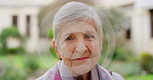 Face, wrinkles and retirement with a senior woman standing outside in the garden of her home alone. Happy, smile and