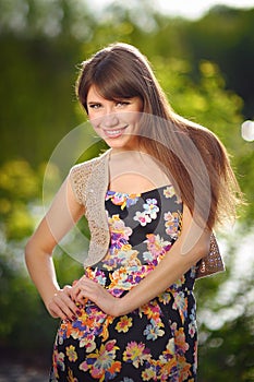 Face young beautiful girl dark closeups short hair summer park s