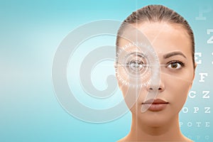  face of young beautiful woman with hi-tech laser eye surgery concept