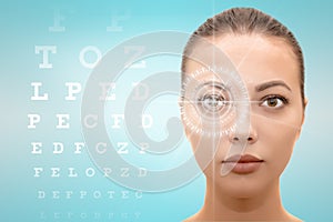  face of young beautiful woman with hi-tech laser eye surgery concept